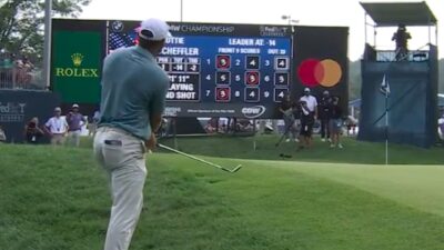 Scottie Scheffler hits a chip shot