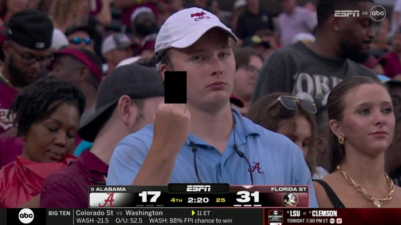 An Alabama fan flashing the middle finger