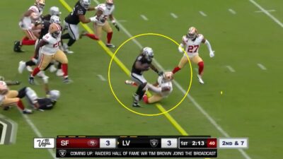 Ashton Jeanty runs over a defender