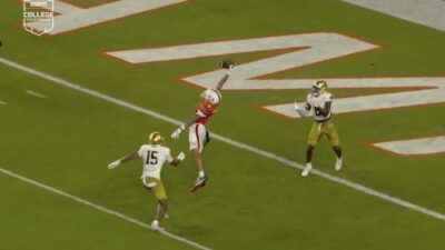 Miami wide receiver CJ Daniels makes a leaping catch for a touchdown