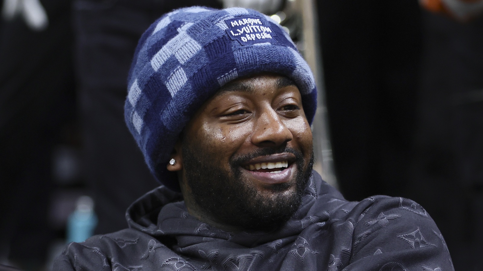 John Wall smiling while attending a game
