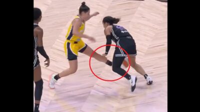 Kelsey Plum kicking an opponent