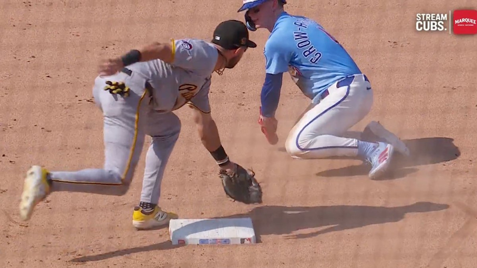 Pete Crow-Armstrong sliding past the base