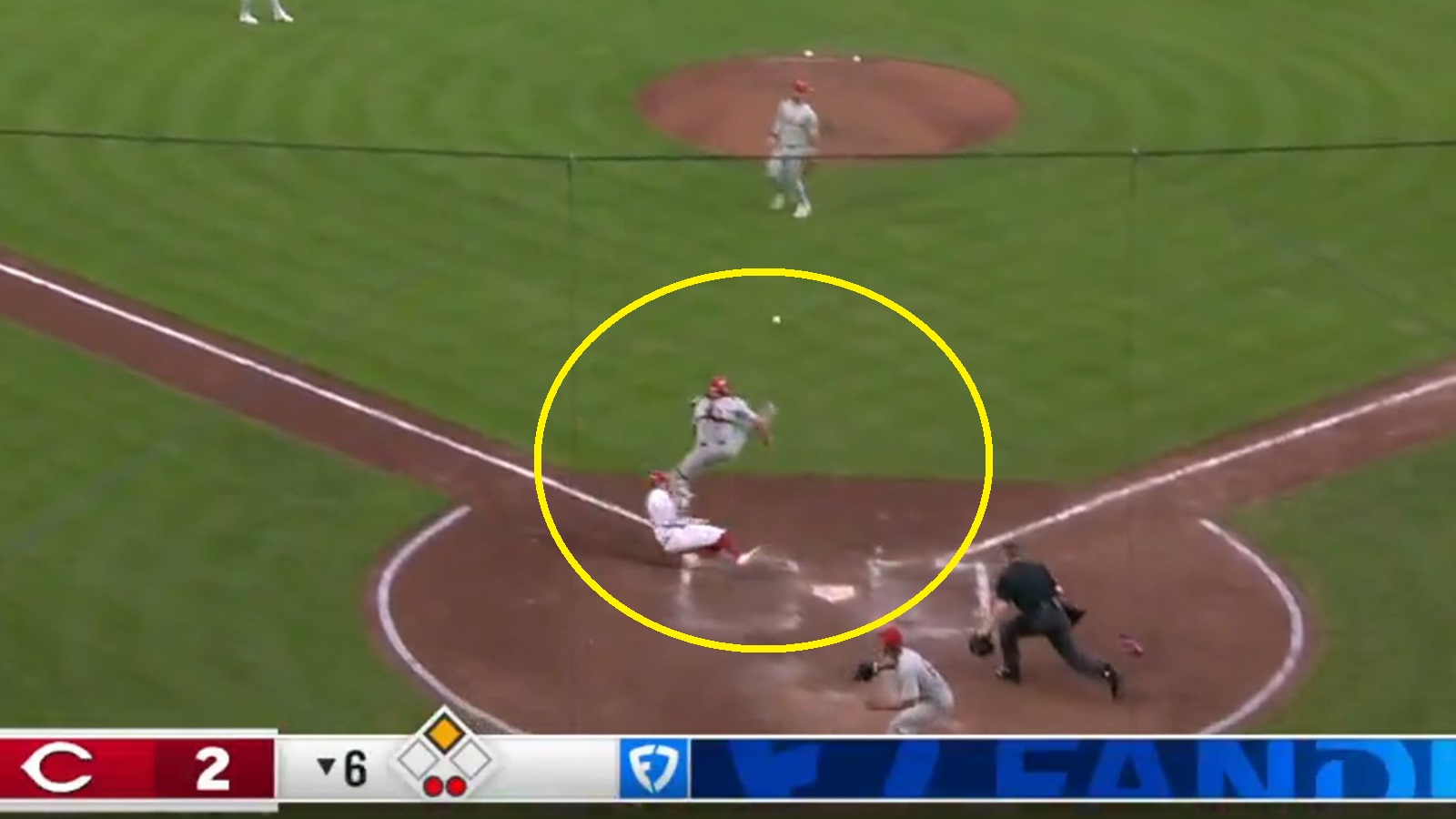 A play at the plate in a Phillies-Reds game