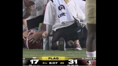 Alabama star wide receiver Ryan Williams lying on the ground with a possible concussion