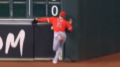 Taylor Ward colliding with the outfield wall