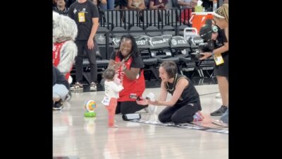 Baby stands up during WNBA baby crawl race