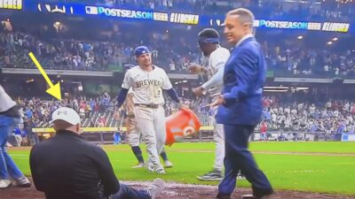 Ken Rosenthal knocks a photographer down
