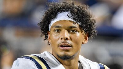 Pierce Clarkson looks on