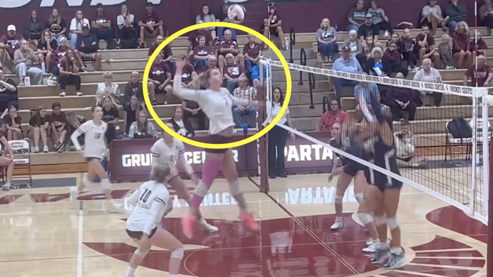 Ryanne Brubaker spikes a ball