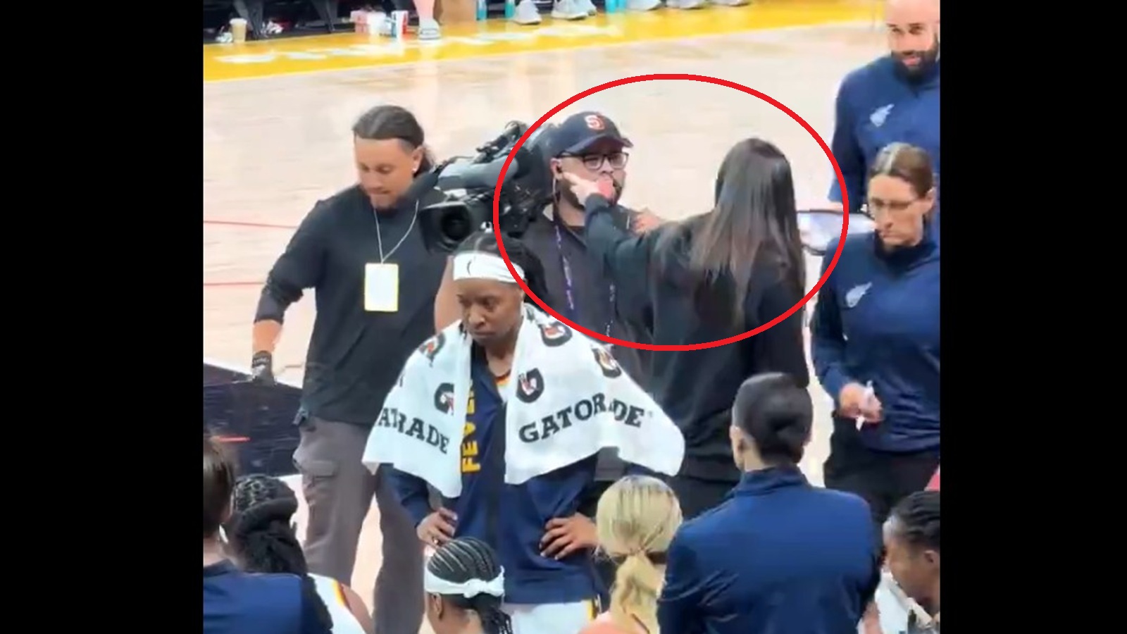 Caitlin Clark confronting a cameraman