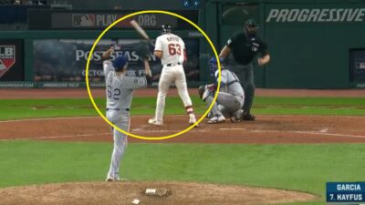 A Cleveland Guardians player getting hit by a pitch