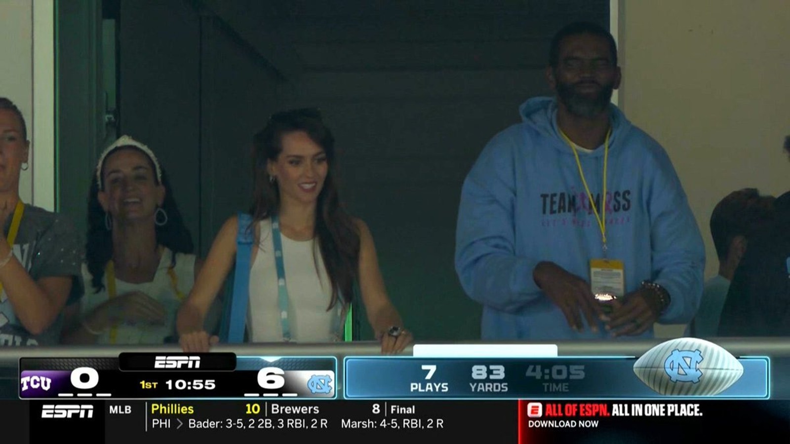 Jordon Hudson next to Randy Moss at a game