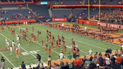 Syracuse players running sprints after a game