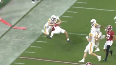 UL-Monroe punter Makenzie Ryan with a hard tackle on Alabama's Cole Adams