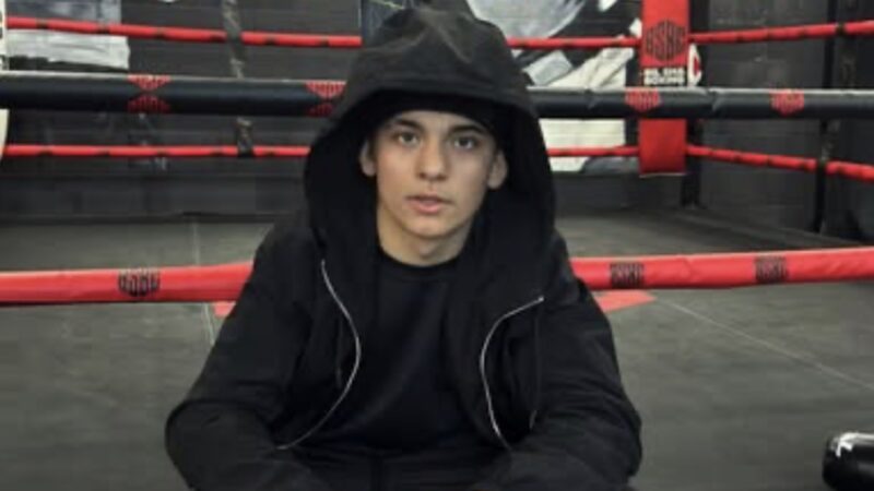 Arturo Gatti Jr. sitting on a boxing ring