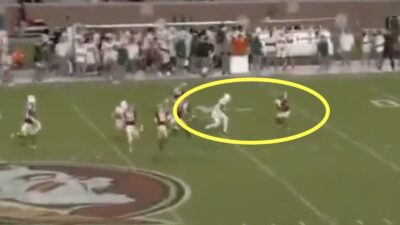A Miami player delivers a hit on a punt return