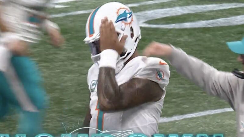 Tua Tagovailoa covers his eye to celebrate a score