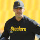 Aaron Rodgers in a Steelers hoodie