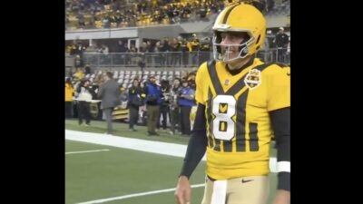 Aaron Rodgers wearing a Steelers 1933 throwback uniform