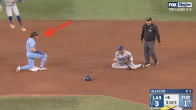 Blue Jays' Addison Barger looking on after getting doubled up by Dodgers at second base to end World Series Game 6