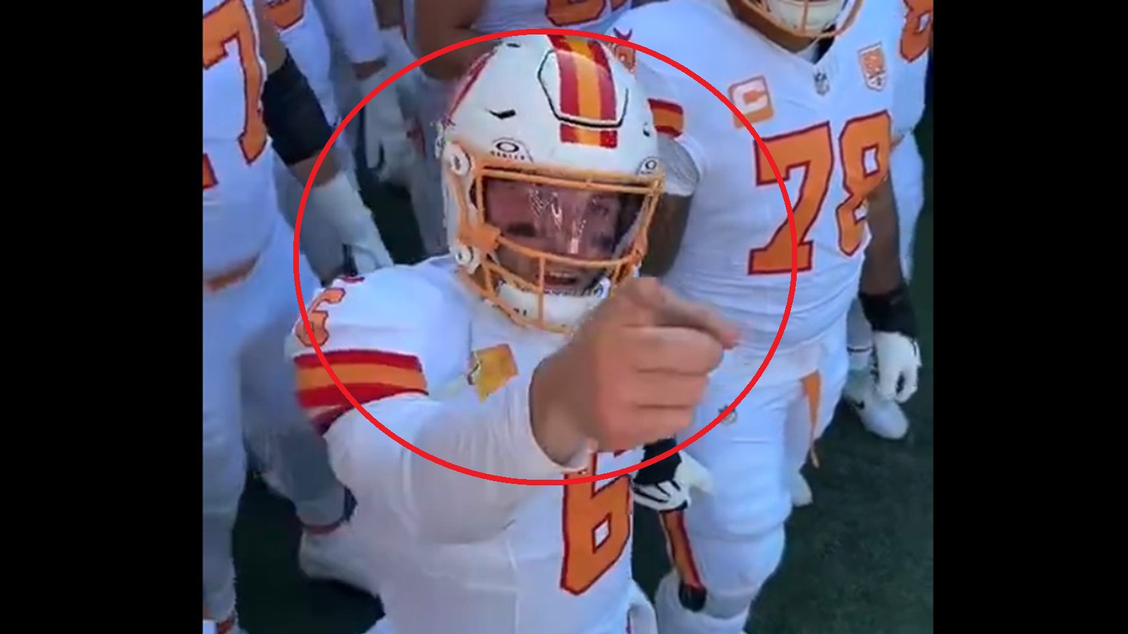 Baker Mayfield pointing at a fan
