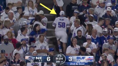 Bills fan running out of Highmark Stadium after catching a pass from Josh Allen