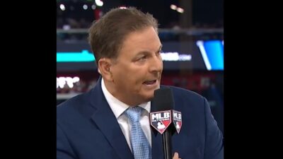 Dan Plesac holding a microphone