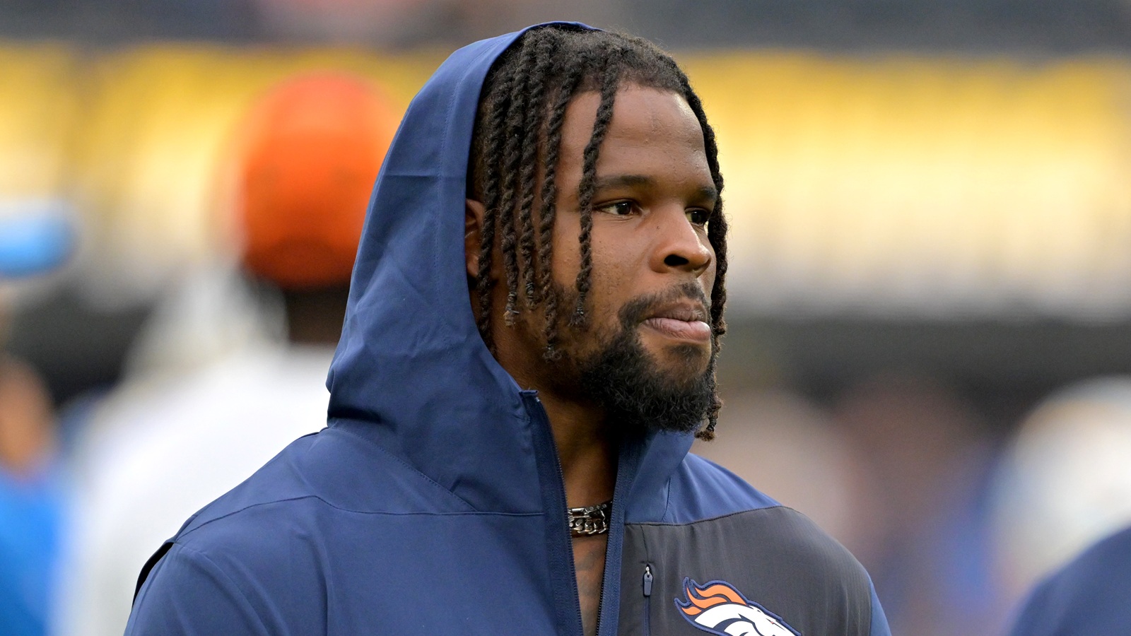 Dre Greenlaw looking on before a game