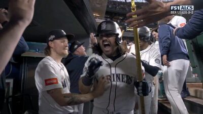 Eugenio Suarez celebrating his Game 5 ALCS grand slam in the Mariners' dugout