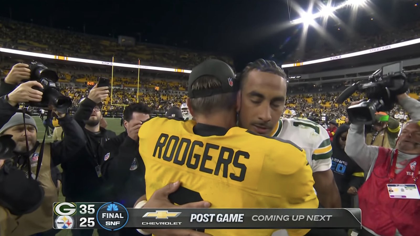 Jordan Love and Aaron Rodgers embracing