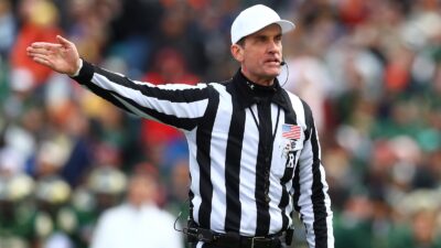 Ken Williamson holds up his arm