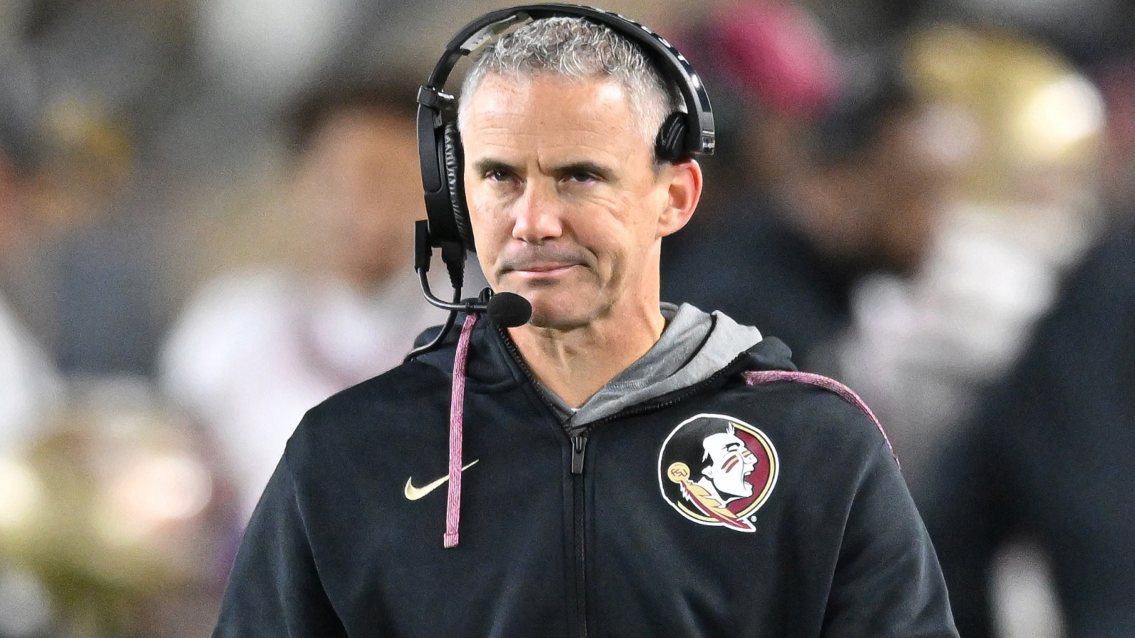 Mike Norvell with a headset on