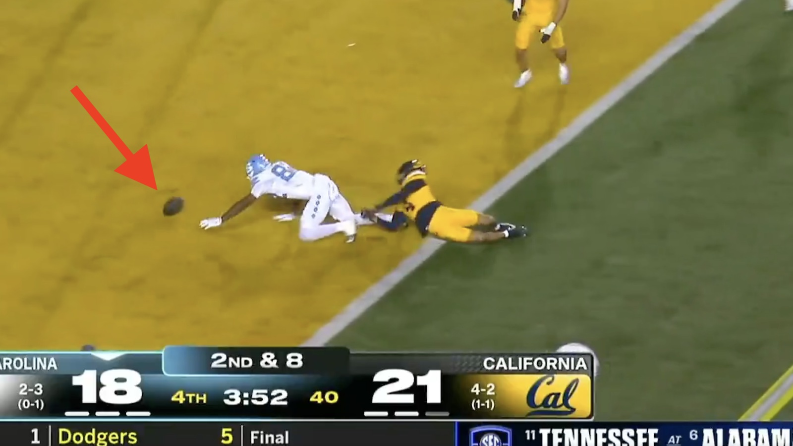 North Carolina wide receiver fumbling in the end zone