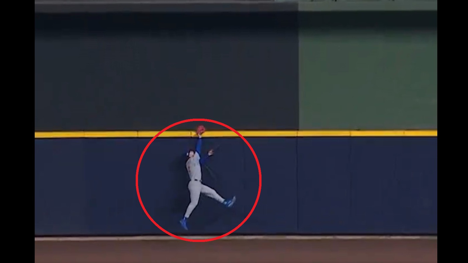 Pete Crow-Armstrong jumping at the wall