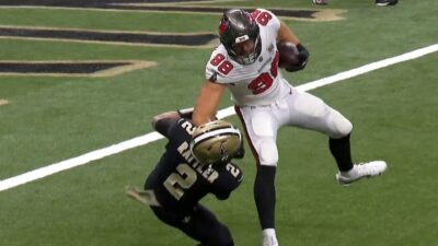 Spencer Rattler getting stiff-armed to the ground