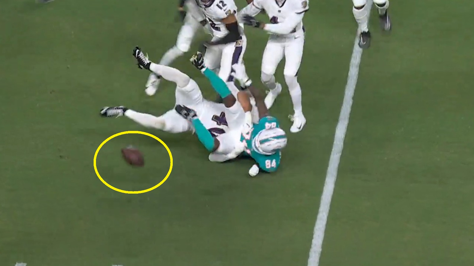 Tahj Washington fumbling the ball