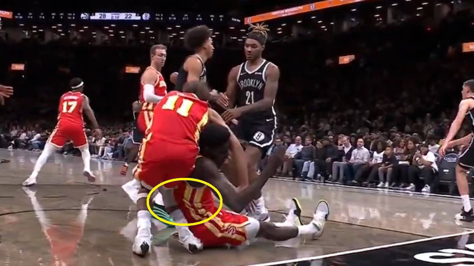 Trae Young falling to the ground