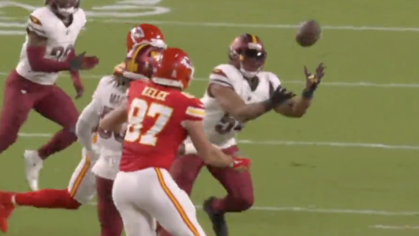 Chiefs tight end Travis Kelce tipping a pass, which turned into an interception