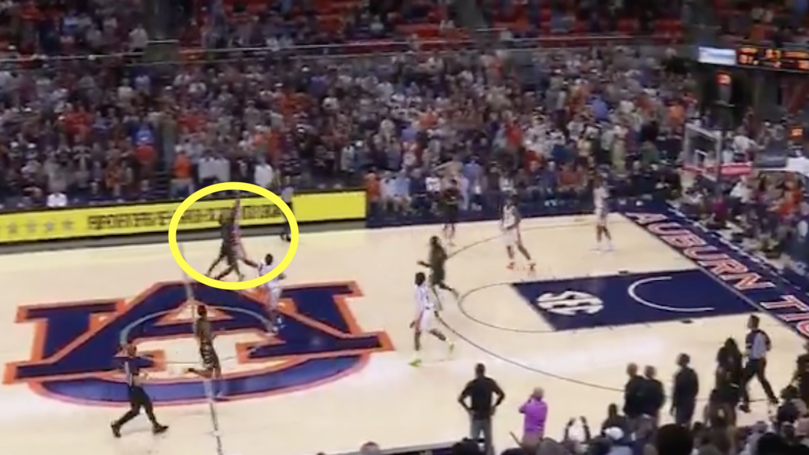 Auburn fouls a player on a half-court shot