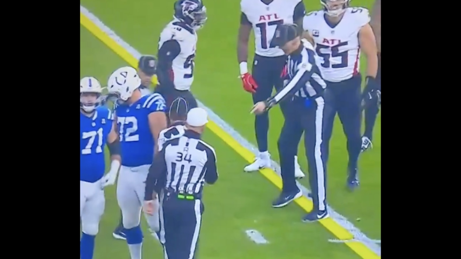 The officials spot the ball for the Colts