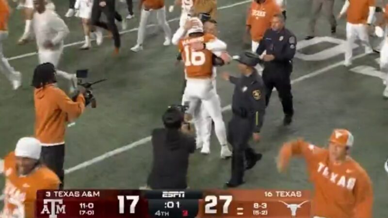 Arch Manning hugs Steve Sarkisian