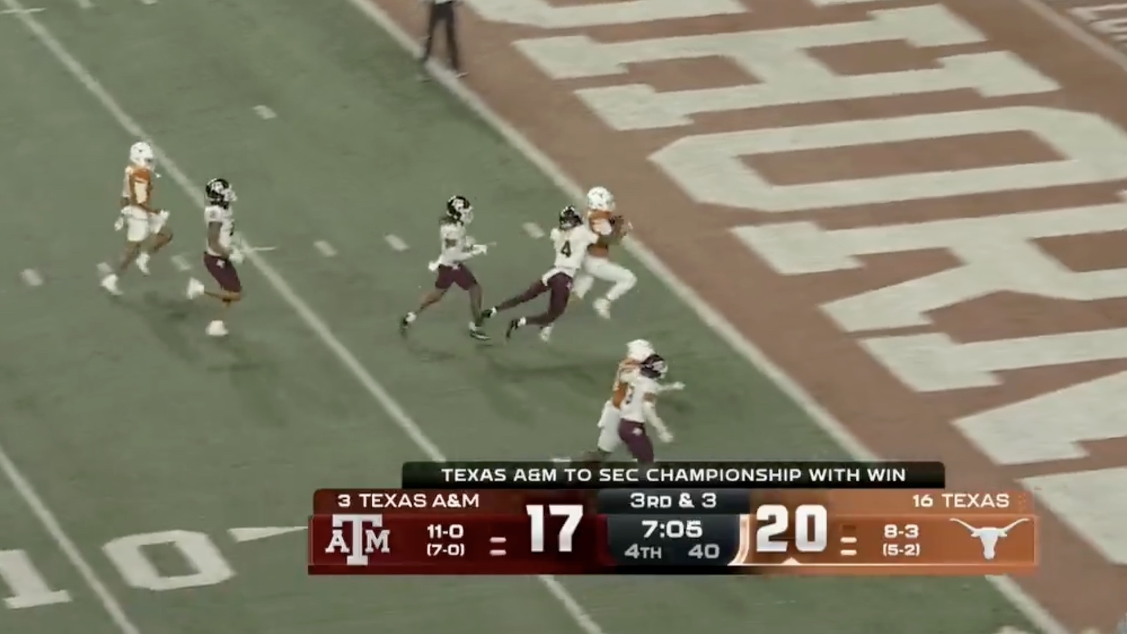 Texas QB Arch Manning scoring a rushing touchdown against Texas A&M