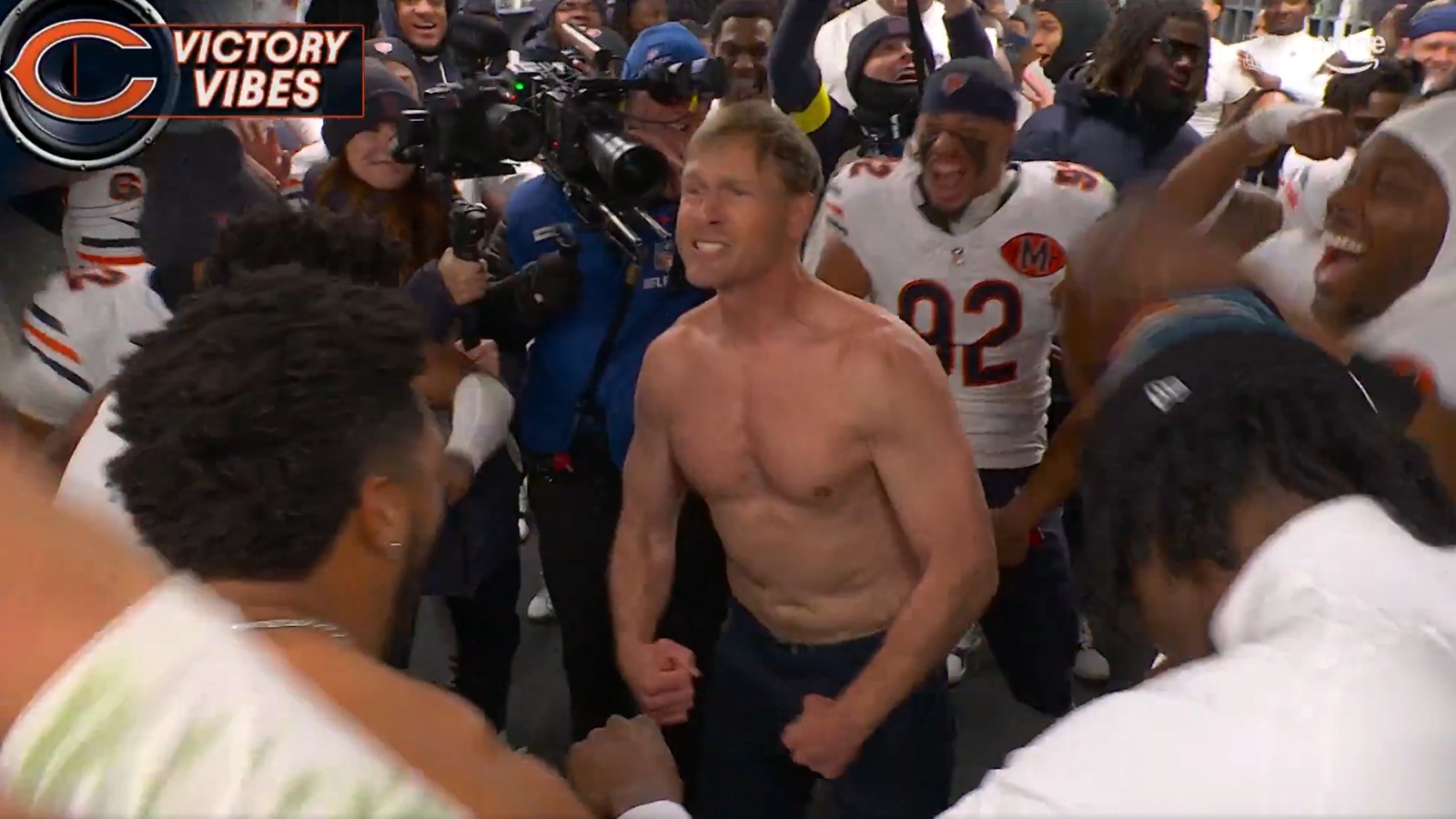 Ben Johnson rips his shirt off during Bears’ postgame celebration