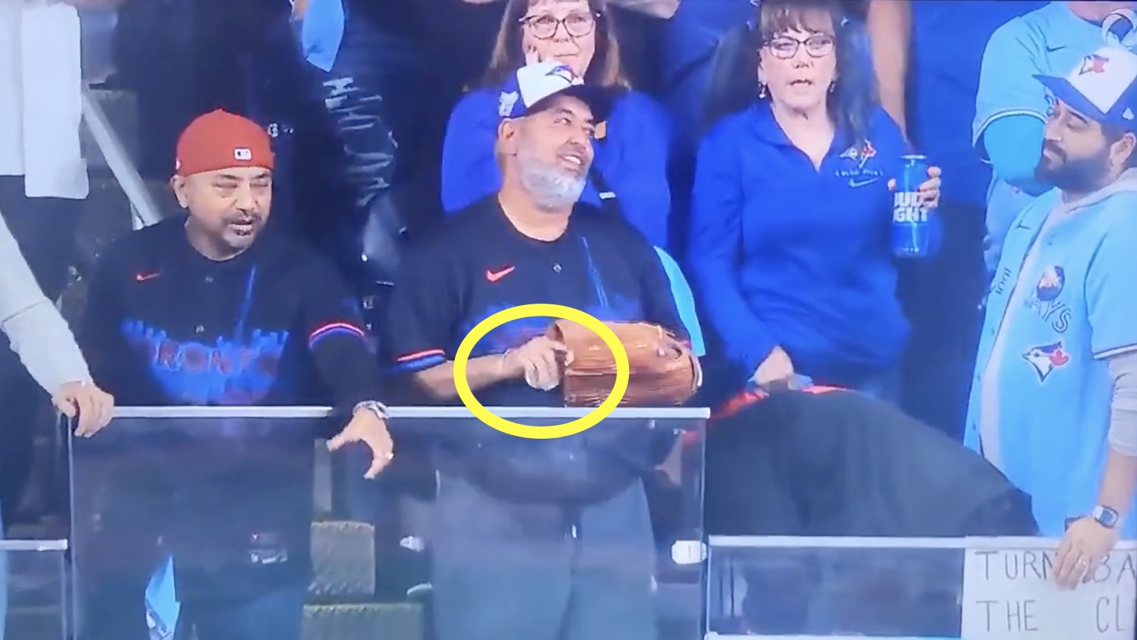 Blue Jays fan hiding a fake ball to throw instead of Miguel Rojas' Game 7 home run ball