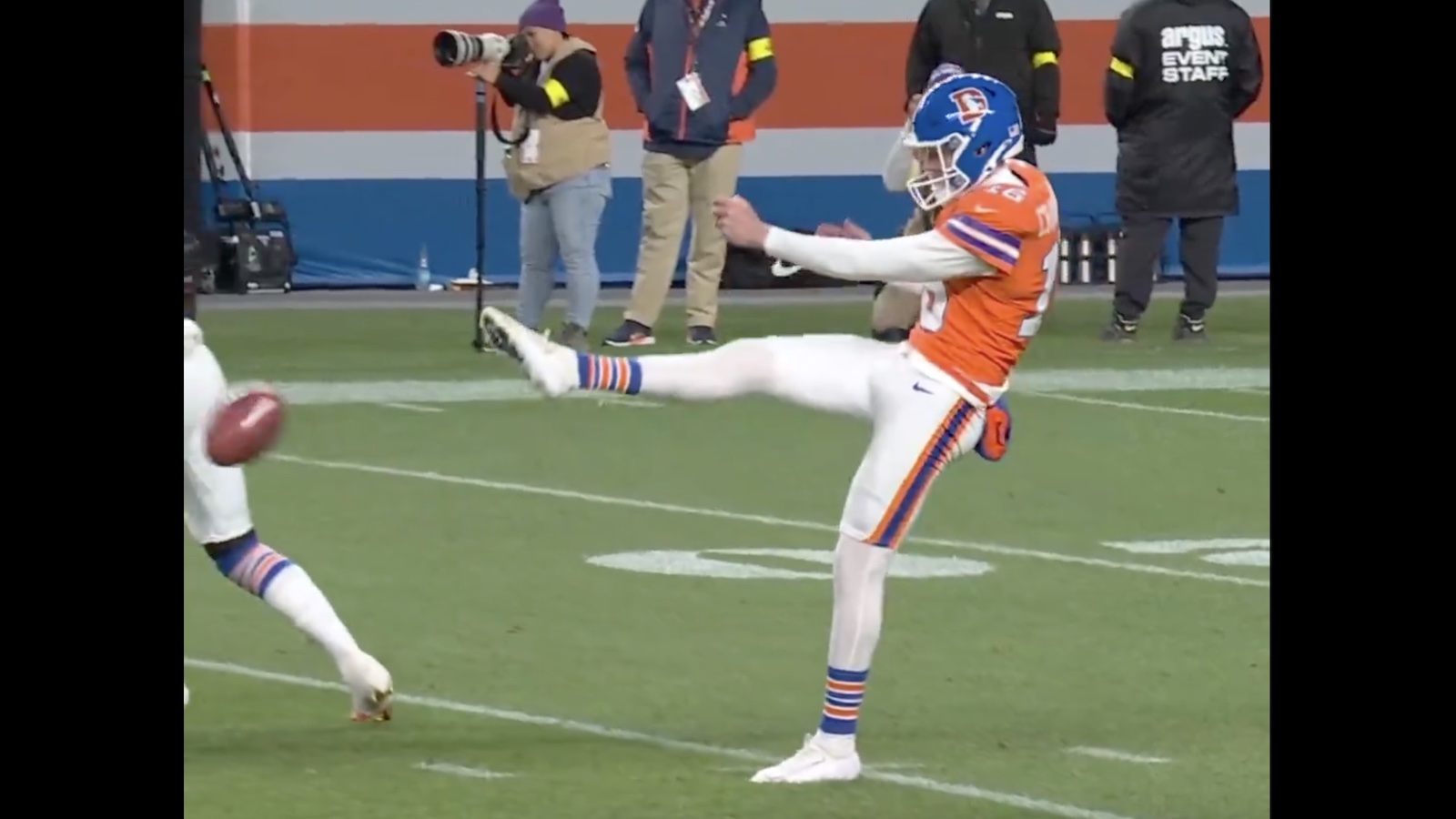 Broncos punter Jeremy Crawshaw botching a punt