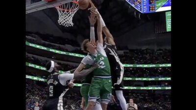 Giannis Antetokounmpo dunking on Cooper Flagg