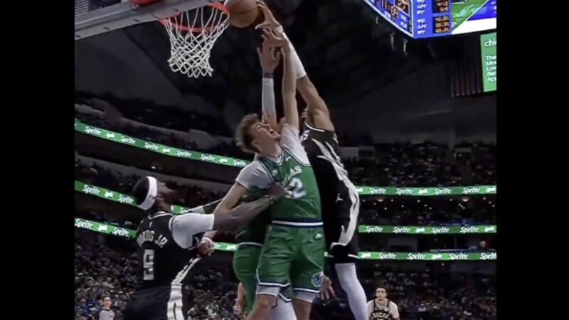 Giannis Antetokounmpo dunking on Cooper Flagg
