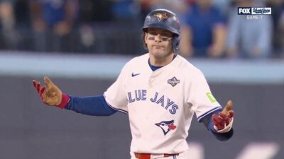 Blue Jays third baseman Ernie Clement shrugging after getting his 30th hit of the 2025 MLB postseason