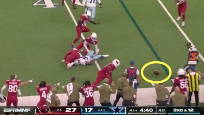 Cowboys' Javonte Williams fumbles the football near the Cardinals' sideline